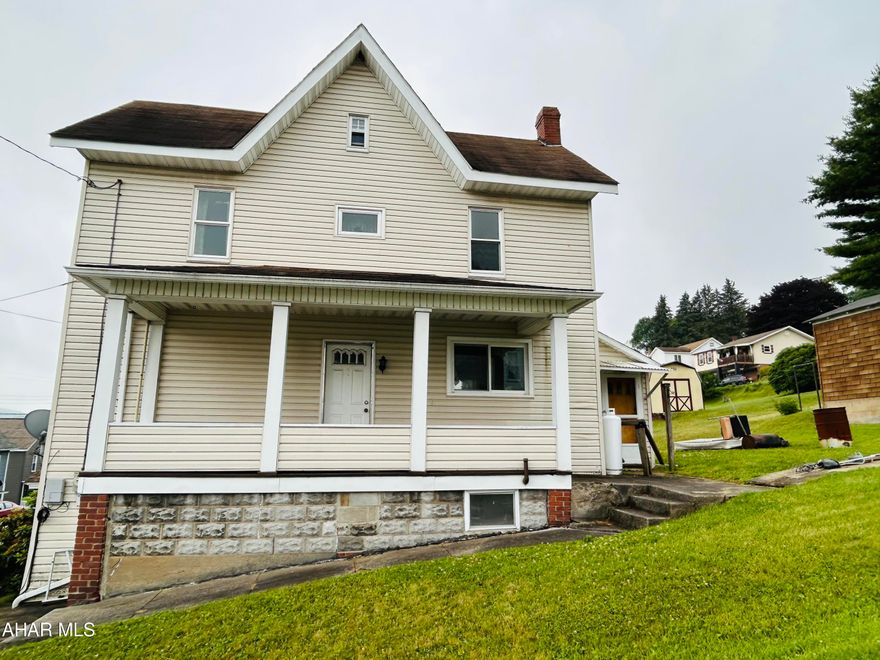 This house is just waiting for someone to come and put some finishing touches on it! Corner house  located in a quiet neighborhood.   A detached garage, nice size yard that can be closed in, first floor laundry, laminate floors, and covered porch are all great features this home offers.  Come check it out today!  Selling house as is.  Seller is in the process of clearing out the house.