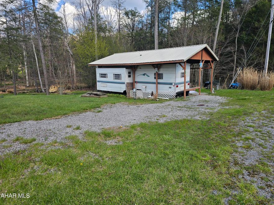 2000 camper on 2 lots inside Glendale Yearound. 2 level mostly private campsites with pavilion over camper with deck attached. There is a small shed and a stream runs through back of lots. Lots of room for parking and guests. Glendale Yearound is a gated community located minutes from Glendale Lake and Prince Gallitzin State Park. Community pool, tennis, basketball, and more.
