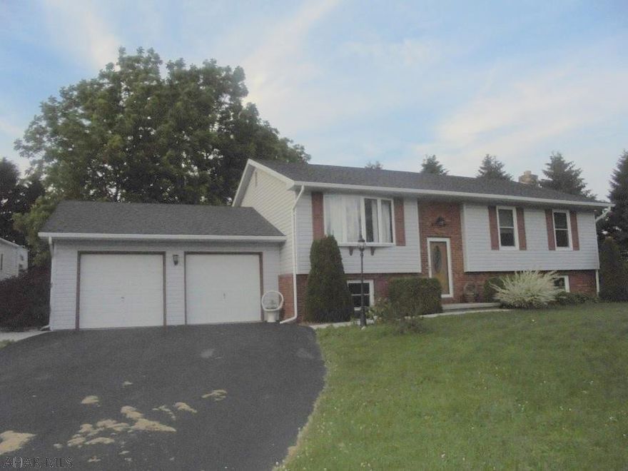 Ebensburg- 3 BR, 1  bath brick and vinyl sided bi-level home on a level, spacious corner 1 acre lot. New windows, large level composite deck for entertaining. Family room w/stone fireplace. Possible 4th BR or office. Basement remodeled with new dry wall.  Buyer can pick new flooring.