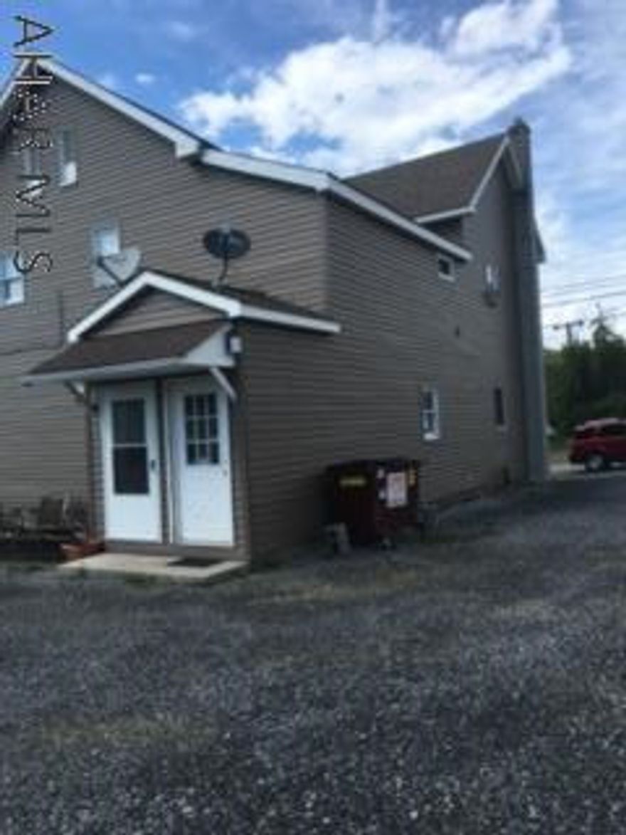 Welcome to the newest addition to your investment portfolio. This 4 unit is already making money! Four very clean and well maintained efficiency apartments. Washer and dryer on each level for the tenants to share. Storage closets in common areas on each level plus outdoor shed. Each unit has a well equiped eat in kitchen, living room, 3/4 bath and bedroom. Each unit also has its own programmable thermostat. Utilities include; heat, water,garbage,lawn service, and snow removal. There is also a private parking lot with designated parking for each unit. There is a seperate heated garage for additional income. Currently used for motorcycle storage in winter. Turn key operation! Call for your showing today!