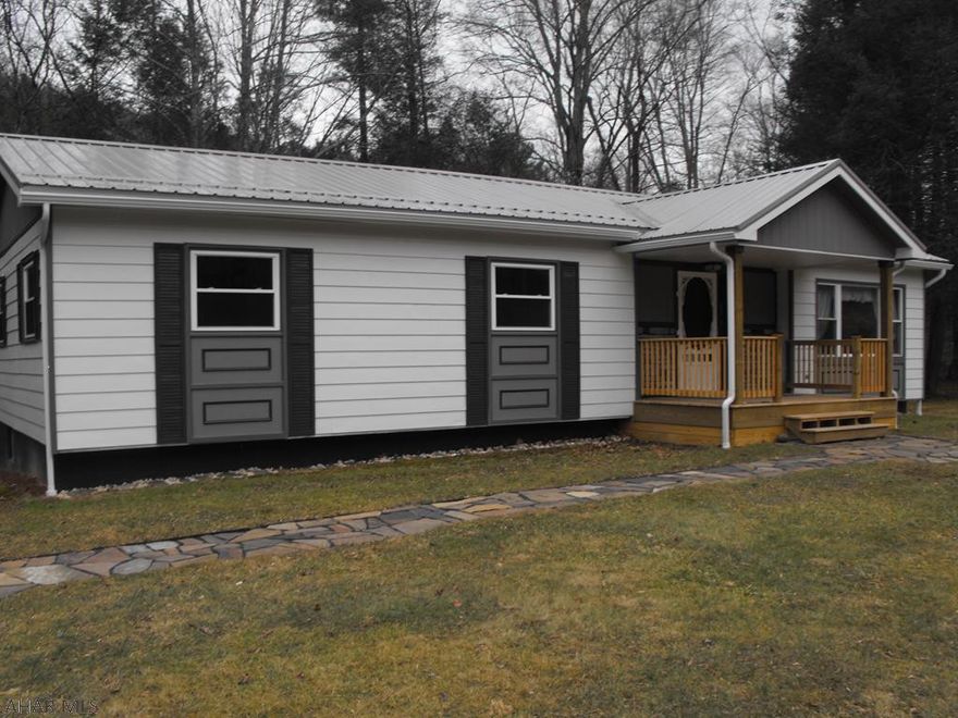 Looking for the ideal property? How about this ranch house situated in an idyllic setting, among the trees, with a beautiful pond and a creek? Also backs up to State Game Lands! One level living with full basement. Freshly painted, new lights, floor coverings, new windows and roof! Move-in ready. Brand-new spacious front porch and redone back deck as well to sit out and enjoy nature.