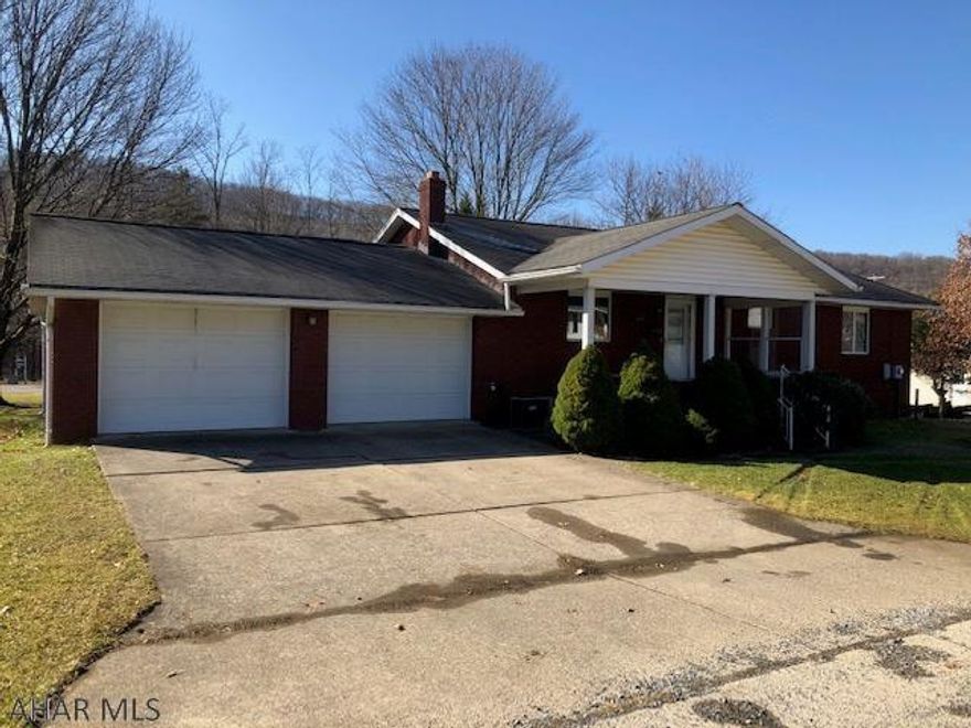 Well built and maintained solid brick home with plaster walls, basement rec room and work shop, 2 car garage on double corner lot.