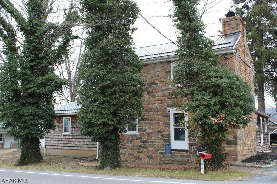 Circa 1784 historic stone home in the beautiful little town of Rainsburg. Three bedrooms, 2 full bath with beautiful hardwood floors, woodburning fireplaces, closed in sunroom with large windows, first floor master suite, grape arbor, and detached garage/garden shed. This home features a new roof, refinished hardwood floors, updated bathrooms, new french doors, ceramic tile floors in bathrooms and way too many updates to mention.