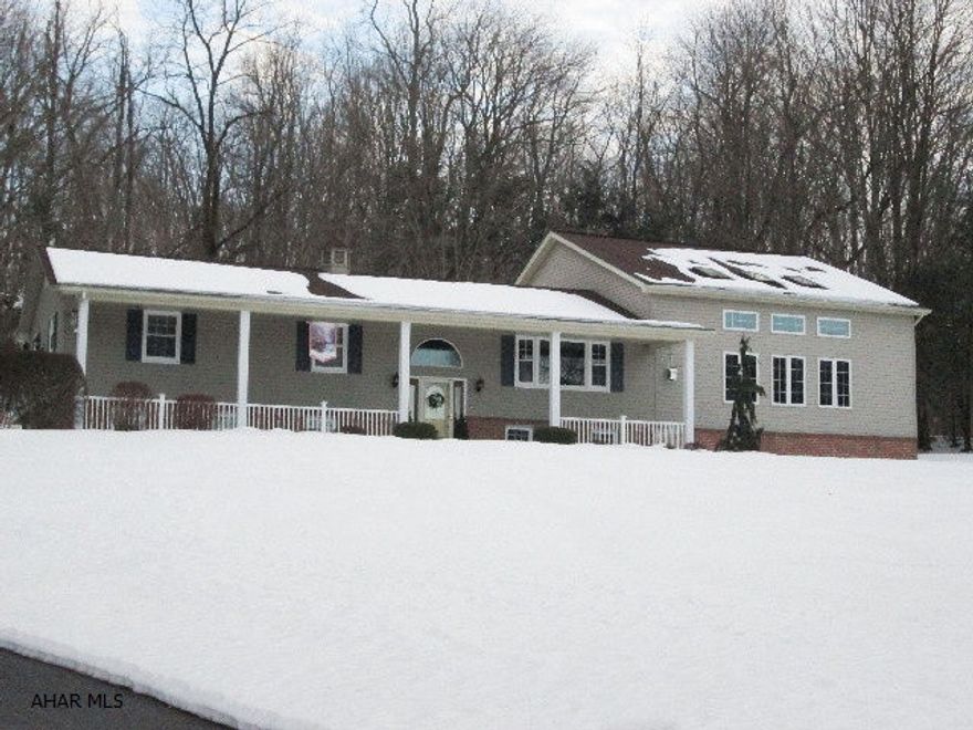 Hollidaysburg/Blair Twp. Immaculate 4 bedroom on private 1.6 acres. Pride of ownership is evident throughout. Every room has been meticulously upgraded. Great room w/vaulted ceiling, fireplace and surround sound. Beautiful gourmet kitchen with granite counters, tile floors, stainless appliances and new cabinets. Formal dining room is very spacious with hardwood floors. The master bedroom suite is private and features a custom bath.