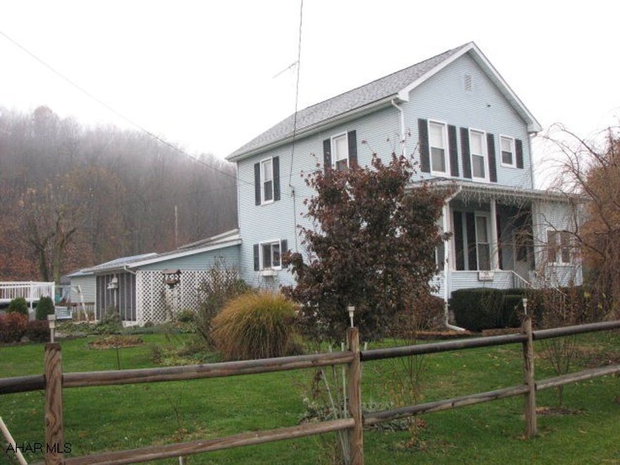 Rural setting but close to town.  Nice level lot with 1 Car Detached Garage and also Covered Carport.  Very nice Kitchen with Oak Cabinets this is open to Dining Area.