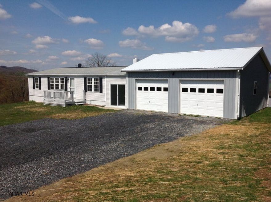 If you are looking for a ranch style home , move in ready and a garage/work shop with 5.09 acres to run around on and a spectacular view then this is your home. This is truly a turn key property.