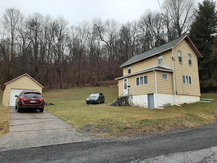 FURNISHED 2 bedroom, 1.5 bathroom, 2-story home along the edge of Nanty Glo.  Large lot that butts up to the woods. All appliances included:  refrigerator, new gas stove, microwave, washer, dryer, 2 window a/c units, and a dehumidifier.  One-car detached garage (new garage door), sunroom, new gutters.  Everything in the home is included.  Some of the items in the garage will also be included. Call listing agent to schedule a tour.