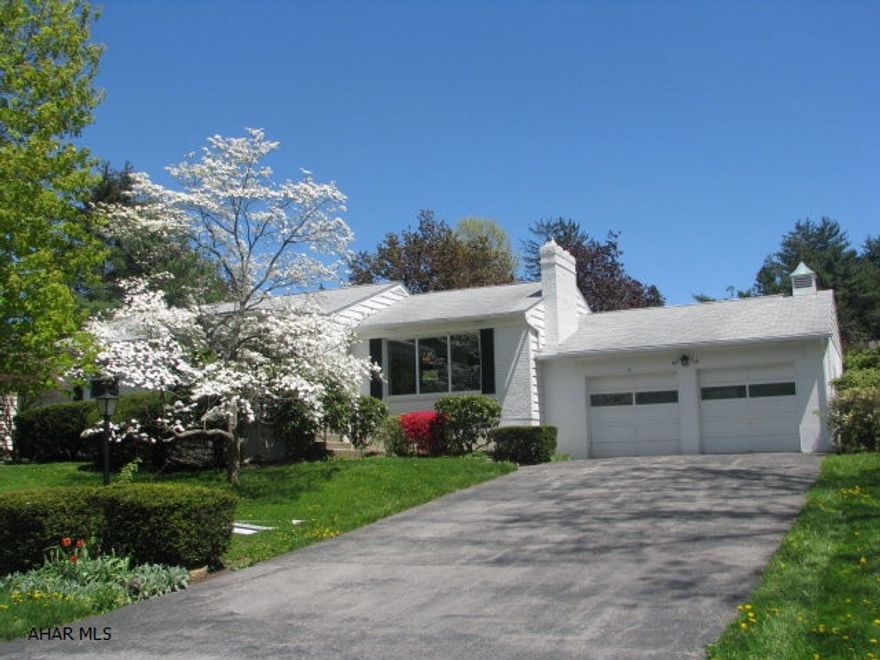 What a wonderful time of year to list this home.  The new owner will see the full beauty of the landscaping.  This is a home in a much sought after neighborhood.  All of the windows except the living room have just been replaced and have a lifetime warranty which is transferable to new owner.  This is a big plus when it comes to heating.  The kitchen has been updated as well as the baths. The front and back doors have beautiful etched glass panels.   The finished basement has a full wall of built ins and a bar.  There is also a laundry and plenty of storage down there. First floor has a large cedar closet. The majority of the home is carpeted but the original hardwoods are underneath.   There is a nice size deck on the back where you can relax and enjoy the quiet!!