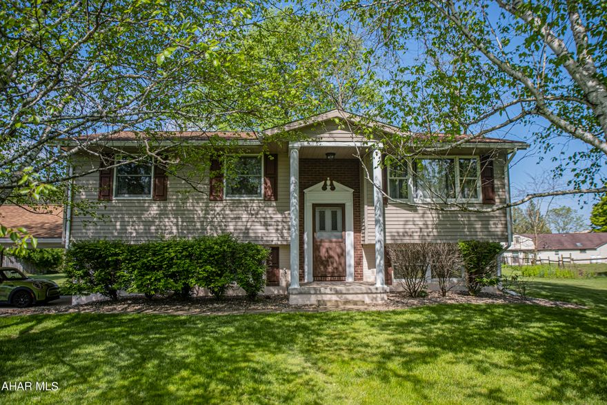 Meticulously maintained 3 bedroom, 2 bath Bi-level home located in the desirable Foot of Ten area of Duncansville! This home features a completely updated main bathroom that was done approximately in 2021, lower level recreation room, plenty of storage with cabinets/work area beside garage, carport, central air,  and a covered back porch that offers additional storage underneath. With a newer roof, hot water heater, and heat pump the main components of the home will not be a worry for many years! All you need to do is add your personal touches with paint and flooring!