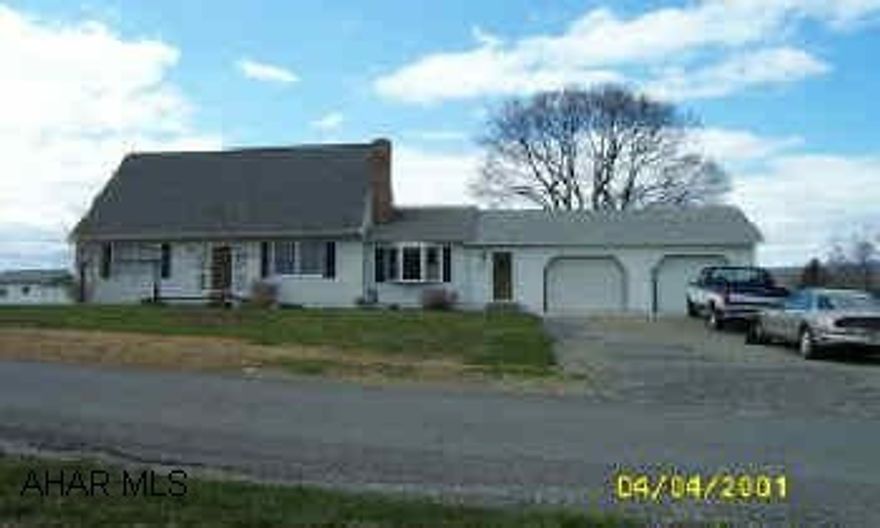 Extremely nice home inside & out... Beautiful kitchen w/large island; dining room with fireplace; 19'x24' familyroom with oak & marble accents; 1st floor laundry; tile floors in kitchen, 1/2 bath & entrance; new carpeting throughout; new roof on house, roof is 6 yrs old on addition; oil hot water heat - furnace 7 yrs old; mostly new windows, city sewer, private well w/uv light; hookup to city water available at street; deck in back.