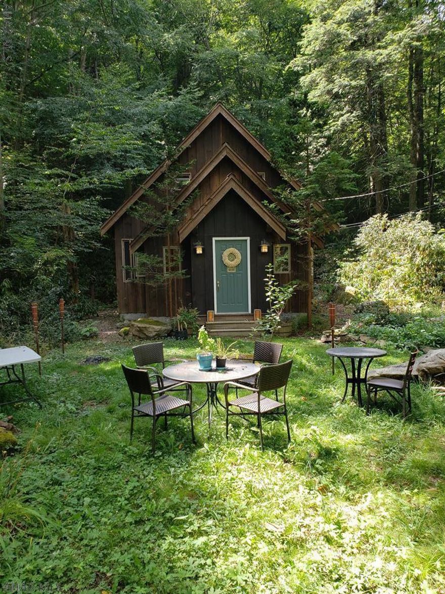 Peaceful is not the word for this home. Please look at pictures and virtual tour. Top quality built. Stream and water falls on property.