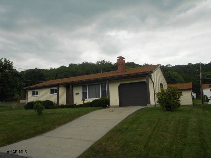 Are you looking for one level, in town living with low maintenance. Off street parking, 1 car attached garage, 2 car detached that has electric, water and heat. Fenced yard and easy care landscaping. Inside, enjoy the 4 season sunroom with cozy pellet stove on cold days, and on hot days enjoy the central air! Three bedrooms, one full bath on main level. Finished basement space with family room, full bath and work room.