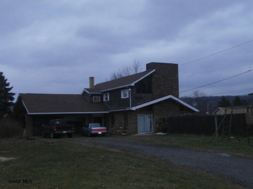 Large home partially remodeled. Large living room with beamed ceiling and fireplace. Master bedroom has fireplace. Breezeway between garage and home. Inground pool.