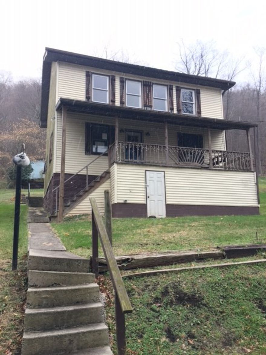 4 bedroom, 1 bath home overlooking the river. Needs TLC. 12x26 shed. Updated electric.
