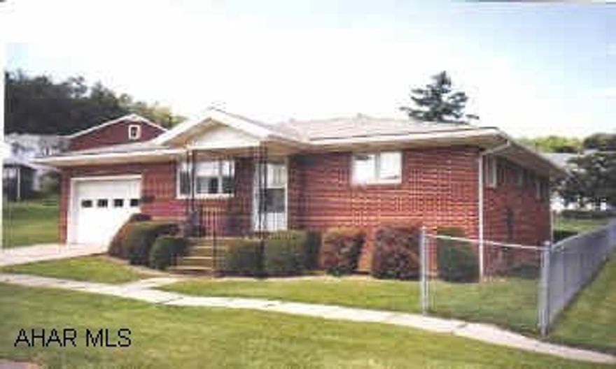 nice brick home on corner lot, hardwood floors, attached garage, enclosed back porch