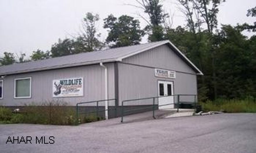 30 ft. x 120 ft. well insulated steel building on 1 acre.  OSB walls, oil forced air heat.  Full Basement.  Large open space and several offices. Take Rt. 30/ Lincoln Highway East; take Huntingdon exit onto Rt. 26 North; approximately 1/2 on the Left.  (3 miles outsdie of Everett).  Large gray building.