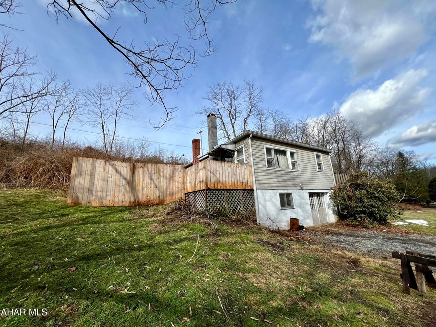 Raised ranch overlooking the Raystown Branch of the Juniata River. This could be a great get-away place or for year-round living. This home offers a large living room with wood burning stove, an eat-in kitchen, two bedrooms and a full bath. Enjoy on site fishing, boating or floating down the river.  The area is in close proximity to state game lands and the H&BT rail and trail system for hiking and biking.
