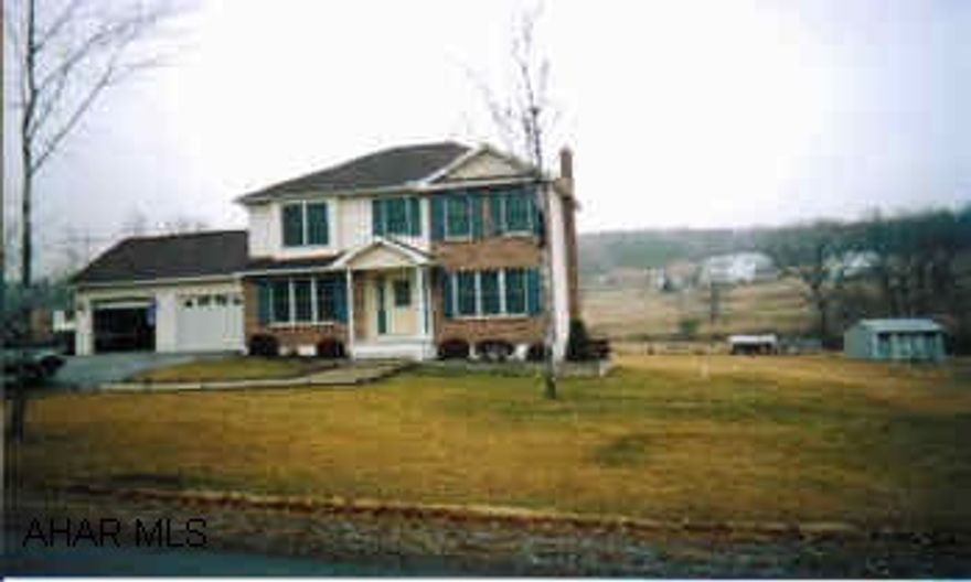 Eat-in kitchen, master bath with whirlpool tub, ceiling fans, plenty of storage above garage, water softener (owned).  Seller has agreed to allow $2,000 for repair of front steps and to add drainage pipes at the end of driveway.