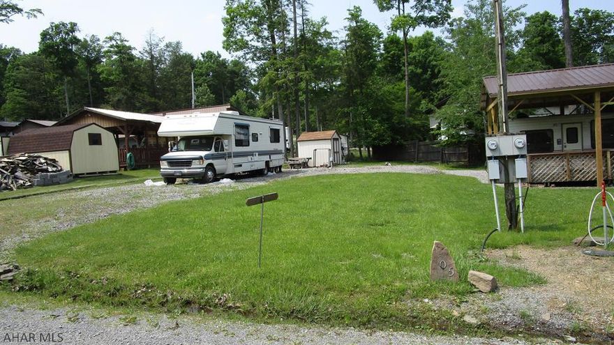 Nice campsite with shed ready for your camper.  Camper shown is not included.  Land only.  Located in Fox Ridge Campground in Glendale Yearound, a gated recreational community adjacent to Prince Gallitzin State Park / Glendale Lake.