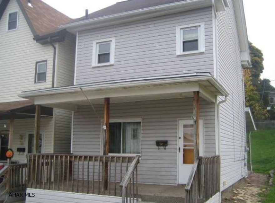 2 story vinyl home in need of TLC. Living room formal dining and eat-in kitchen. Needs work throughout interior. AS-IS sale. Seller will make no repairs.