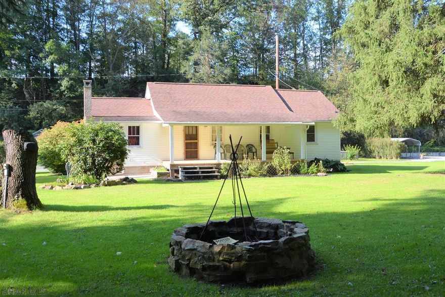 Hard to find river cottage located minutes from Historic Downtown Bedford. This property offers a wonderful place to kick back and relax with family and friends with a covered porch overlooking the large yard with stone fire ring and the Juniata River. Many recent updates have been done.