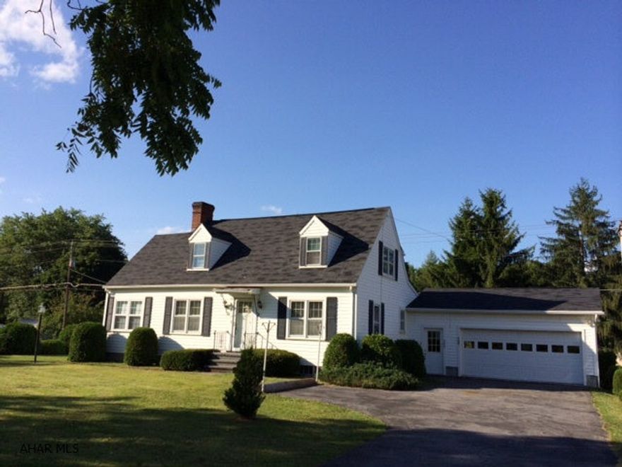 Attractive Cape Cod with family room addition. Extra large lot with possibility of an additional building site.