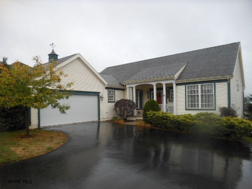 Stunning custom built  3 bedroom, 3.5 bath Ranch Style Home. Open floor plan, cathedral ceilings, architecturally designed columns,Great room with lovely fireplace and built in book-cases/entertainment center opening to large dining area.  Spacious master suite with large private bath. Well planned eat-in kitchen and laundry area. Terrific hardwood floors throughout. Very nice and spacious  Rec Room in the basement with a full smaller kitchen and full bath. Lower level opens to relaxing patio and professionally landscaped fenced yard. Large deck for entertaining and enjoying the great mountain views. Lovely, lovely home !!