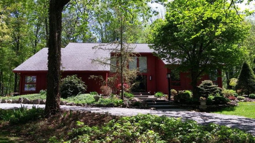 A little piece of paradise. One of a kind home that sits on 2.33 private acres. Beautiful kitchen with Corian counter tops, new stainless appliances and solid bamboo flooring. Living Room and Dining Room are joined by a double sided gas fireplace with vaulted ceilings and doors to the stone patio. First floor laundry and half bath. Master suite with huge master bath and vaulted ceilings. Basement is fully finished. Family room has just been painted and new flooring added. The workshop is every man's dream. Attic storage above the garage. Landscaping is out of this world. Large and private stone patio. Perfect for outdoor entertaining.