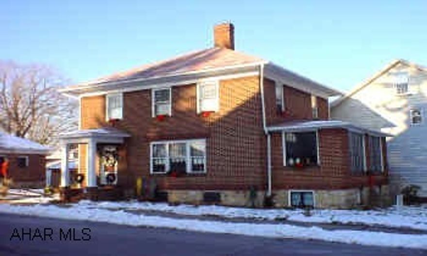 2 1/2 story brick with 3 bedrooms, fireplace in living room, updated bath, sunroom, natural woodwork throughout, hardwood floors under carpet, and 2 car detached garage. Newer carpet, newer furnace, newer roof in 2003, and updated electric in 2004. Great curb appeal! Motivated Seller!
