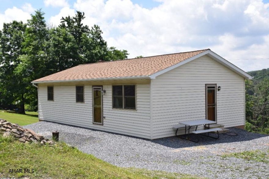 Country living.  This extremely well maintained home is situated on 2.77 cleared acres.  Large 22 X 44 garage with adequate electric for work shop.  Many producing fruit trees.  2 minute walk to State Game Lands for hunting. Home is built to be comfortable and manageable in hard winters and cool in hot summers.  If what you want is truly to be away from it all, this is the home for you.  There is plenty of space to add on and make this home what you need it to be. Wildlife abounds!!!  Heat pump and coal/wood burner.    Survey on file.