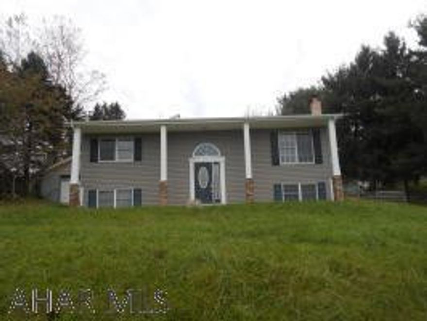 This is a split level home just outside of Bellwood. This home has a two car detached garage with storage.  The rear of the home has a wraparound deck and yard. The lower floor of the home features a partially finished bonus room, utility room, 3/4 bath and a bedroom. The main floor has a living room, family room, dining room, kitchen, full bath and two bedrooms  Family and dining rooms have access to the rear deck. The home is selling in AS IS condition. Remodeling needed.  With some custom touches, this house could be your home