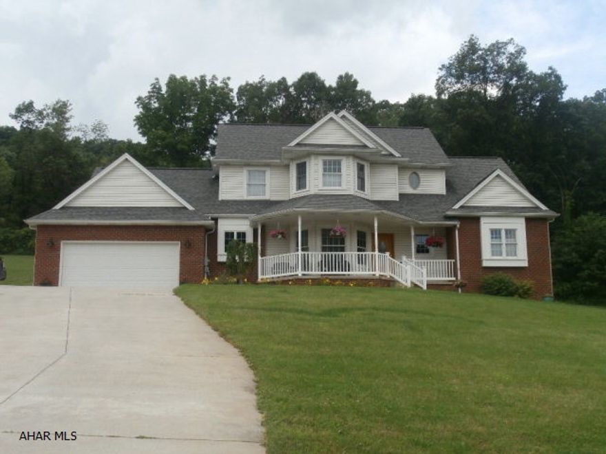 Beautifully maintained 5 bedroom brick and vinyl home with mountain views in Castle Farms.  This home boasts 9 foot ceilings, hardwood floors, oak trim and solid oak interior doors.  Large family room with stone fireplace.  Oak kitchen with granite island, ceramic tile floor and backsplash, breakfast area, new stainless convection 5 burner range, stainless dishwasher, microwave and refrigerator.  There are 2 covered patios, 1 is screened in.  2 car attached garage, central AC, walk-in closets.  1st floor master suite.  So much to offer in this CCM built home.  3 zone heat system.  All on just under .5 of an acre.