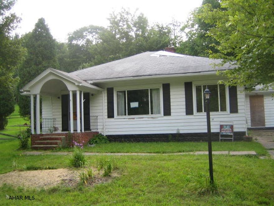 One story living in nice area. Needs TLC.  AS-IS sale. Seller will make no repairs. This property is a short sale. All offers subject to bank approval. Type and functionality of on-lot sewage system is unknown, but believed to be holding tank. Public sewer slated for installation. Buyer must pay $1,450 tap fee plus installation cost of lateral sewer line.