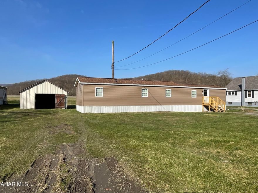 Have you been looking for one floor living on your own lot!!! This completely rebuilt 1998 Skyline is the perfect place to call home.  This home is sitting on a large flat lot with garage for storing toys.  Step inside this home with updated finishings and an open concept layout that is sure to please!  There are 3 bedrooms 1 full bath and laundry located in the hallway by the bedrooms that will help keep your home clean and tidy!  New electrical new plumbing new windows new roof new insulation new flooring new kitchen new bath.