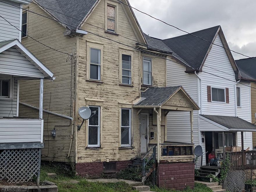 Property needs a complete remodel. Bathroom damaged by fire. Newer 3 dimensional shingle roof and some new windows. Needs everything else.