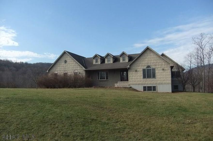 Custom-built home on an unimaginable 34 acres in Altoona. Needs TLC throughout, but could be a real dream estate. Over 4,700 square feet of above grade living space plus large finished basement with second kitchen, multiple rooms/additional living space. In-ground pool in need of work, but easy to see all the possibilities.