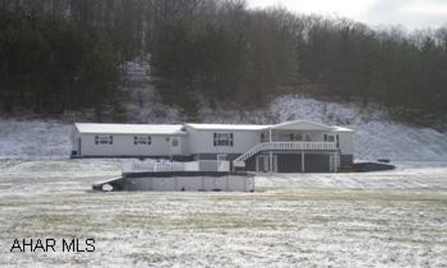 Doublewide with full basement. Basement has large finished game room and office. Beautiful view and country setting. 5 Acres of land.  Storage shed with dog kennels. Moshannon Valley School District