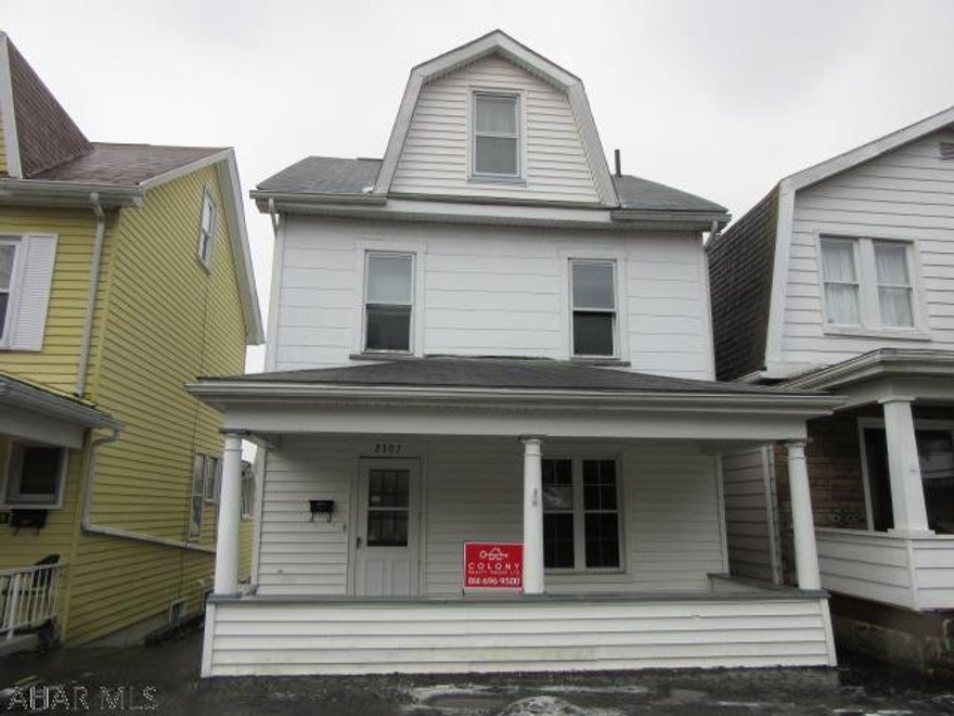 Spacious main floor with bonus room and half bath, fenced in yard, detached garage, finished attic area, laminate flooring