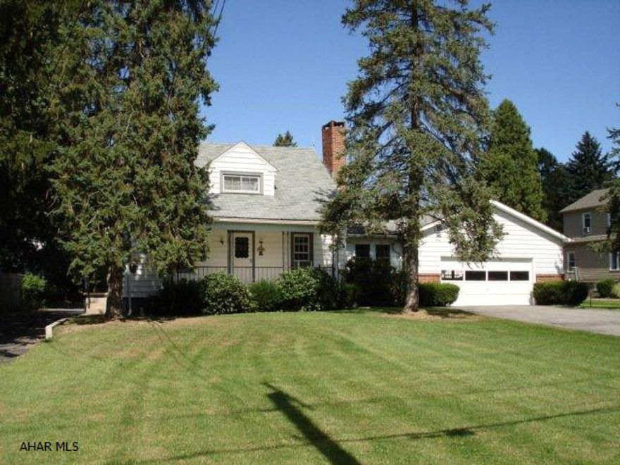 This sweet cape offers a large living room with brick wood burning fireplace with heatilator, eat-in kitchen and dining room combo, heated breezeway converted to a family room, half bathroom and heated back porch complete the main level. The second floor has two large bedrooms and a full bathroom. Additional features include a two and a half car garage, above ground swimming pool, another one car garage currently used to house the lawnmower and a one room cottage that is used as a changing area for swimming. All this on approx. 1 acre. All natural woodwork through-out house. Circular drive-thru driveway. Unique property!! In very nice condition. Easy access to I-99