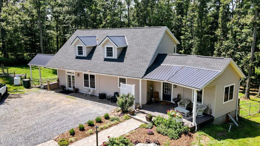 Beautiful newly built Cape Cod on 10+ acres in the peaceful privacy of Bedford county country. High end finishes include granite countertops, Brazilian teak hardwood, ceramic tile, oak hardwood, tankless eco water heater, Kinetico water softener, superior walls and much more! Property features beautiful acreage with a garden, 32x48 pole building with concrete floor and wood stove, 12x46 carport/storage area, ''she-shed,'' chicken coop, additional storage shed, RV power and dump station, rear deck and front covered deck. Addition was planned and is leveled and ready to go if even more space is needed in this 2600+ square foot abode. Attached garage area converted to custom craft space with ample cabinets, concrete countertops, butcher block island and wash tub. Home has so much to offer!