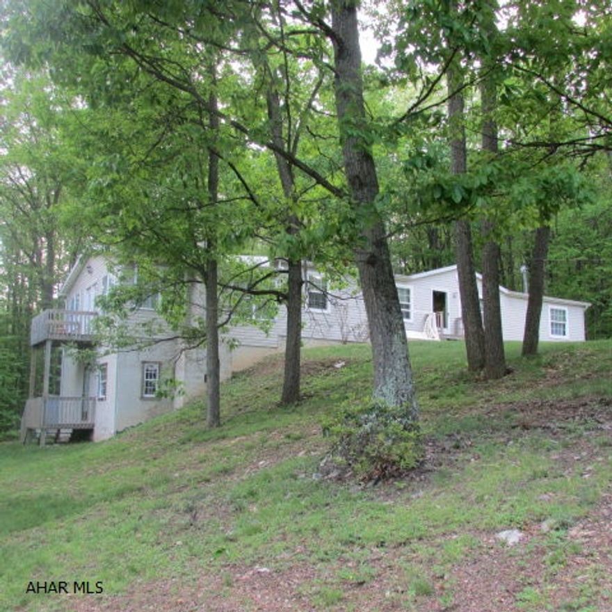 Very spacious well maintained home on 1.37 acres and only five minutes from the Resort or Tatman Run boat launch; 15 minutes to Shy Beaver launch. The home is tucked behind some trees on a semi-private drive. 3 bedrooms & 2 baths plus much more. The kitchen is large w/eat-in area and lots of cabinets. The dining area has corner gas fireplace. The sunken family room is a newer addition with even more space - great for large gatherings. Below the family room is an unfinished 14x14 room with stone wood-fired fireplace. There's a 14x10 back deck along w/side deck. Master Bedroom is on the right w/large walk-in closet and bath w/garden tub, 2-bowl vanity & skylight. Two more bedrooms on left w/walk-in closets. Full bath has skylight. Two sheds.  Great getaway or residence!!