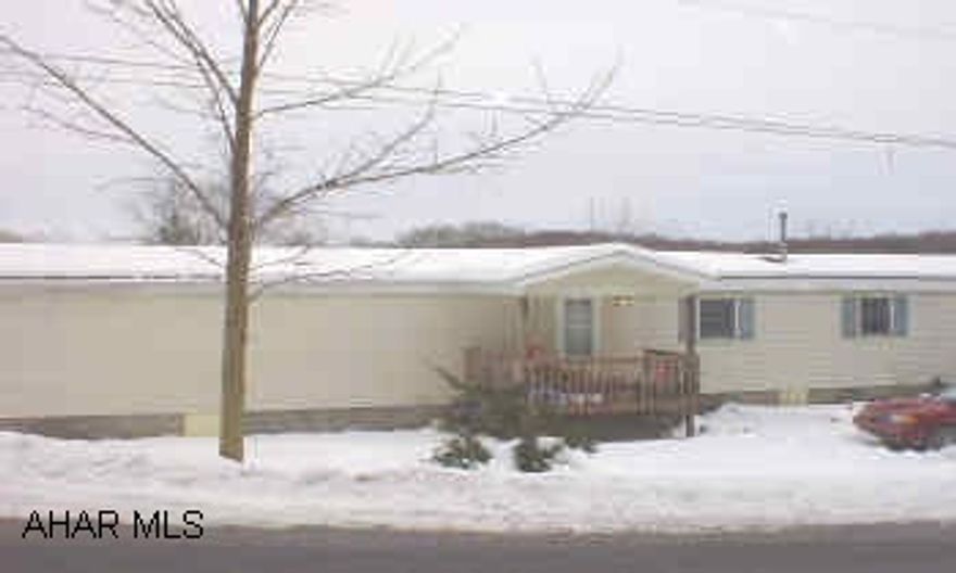 MOBILE HOME ON IT'S OWN FOUNDATION AND GROUND.  3/4 ACRE.  NEWER DRYWALL, INSIDE VINYL SIDED, 3 BEDROOMS, 1.5 BATHS, COVERED FRONT PORCH, COVERED REAR DECK. NICE SINGLE WIDE MOBILE HOME ON 3/4 ACRE WITH PART-FULL BASEMENT, PART CRAWL.  NEWER DRYWALL INSIDE, NICE AMENITIES.  MOTIVATED SELLER.  MUST FIND SUITABLE HOUSING.