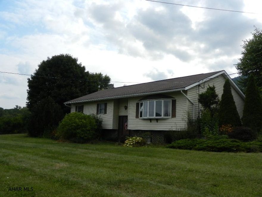 3 bedroom 2 bath Split foyer home situated on 8.8 acres. large 40x 40 garage with new metal roof. full partial finished basement. outdoor furnace.