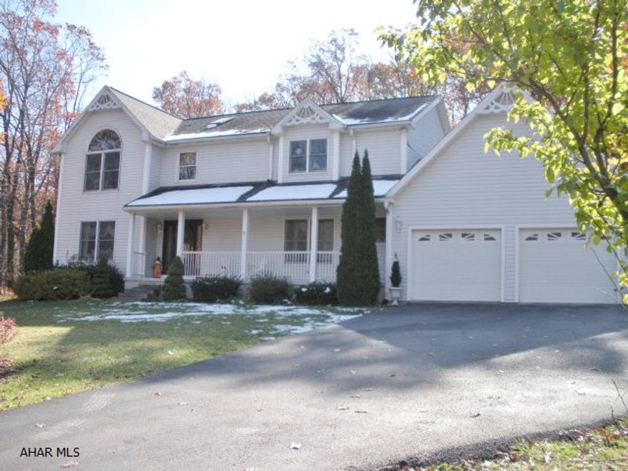 Beautiful 4/5 Bedrooms, 3.5 Baths, home on 4 private acres.  2 family rooms, cherry kitchen with island, 1st floor laundry, master suite with walk-in closets and vaulted ceiling.  Finished lower level with tons of storage, 2 car garage.  Dining room with hardwood floors.  Formal Living Room, Gas fireplace and central air.  In-ground pool with pool house.