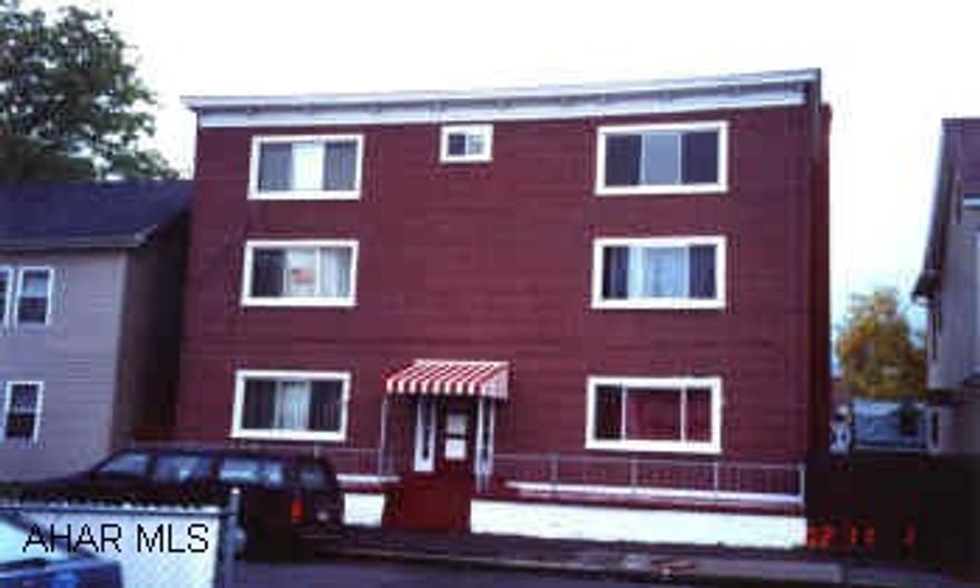 6 Unit apartment building with large seperate garage. Nice 6 unit with one bedroom apartments near hospital.  Extra large garage building suitable for contractor, storage etc.