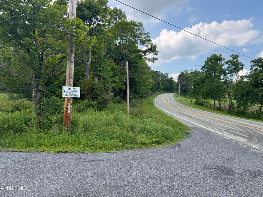 5.5 acre corner site with public water/sewer available - tap fees would need paid. Mostly cleared lot. Former Reade Township Ball Field.