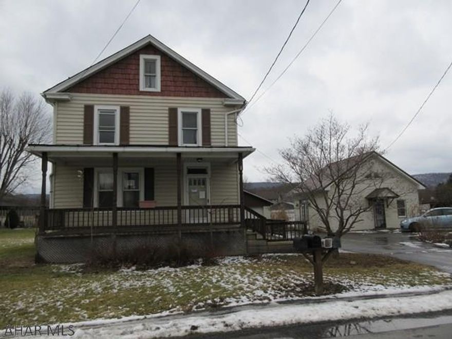 Large 2 Story Alexandria home on level .81 acre lot. Needs some work, but loads of potential throughout. Nice concrete block 2 car garage and large outbuilding/workshop with electric service.  AS-IS sale. Seller will make no repairs.