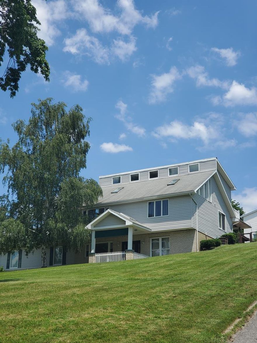 Beautiful one of a kind construction, located in a great neighborhood.  This home features skylights, a working wishing well, central air, a great wet bar for entertaining and a walkout balcony on the second floor.  There are two bedrooms on the 2nd floor with a master bath.  A sunroom off of the bedroom on the main floor and a finished basement that was utilized as a bedroom with its own private bath.   Address in the courthouse records is 2200-2214 13th ave.