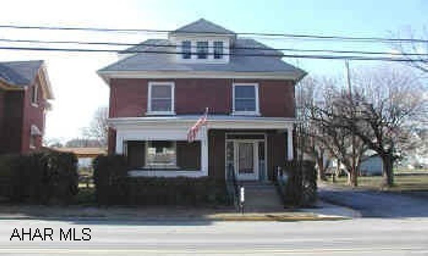 Large brick home on corner lot.  Large rooms.  Repair work needed to heating system.