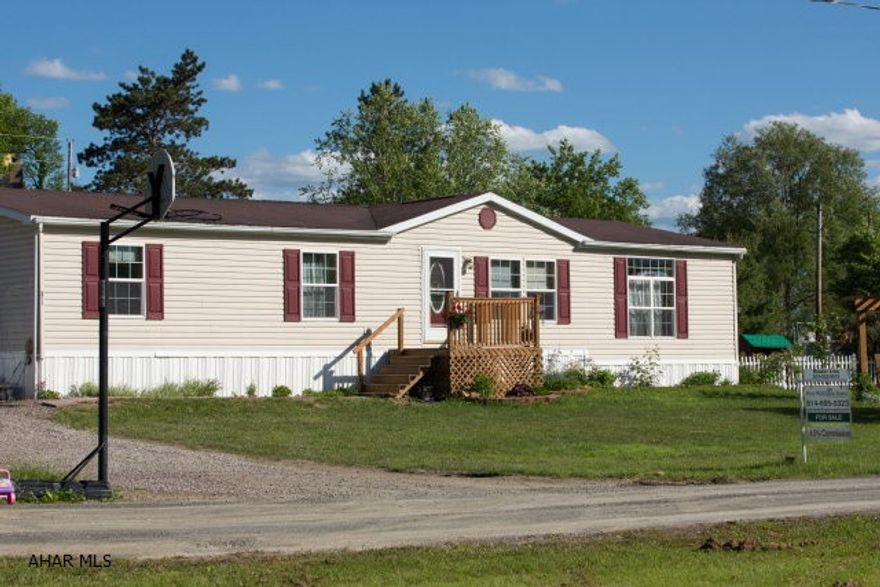 Move in ready Colony double wide. Lots of space, Nice sunken kitchen with large island.  Large living room/dining room with cathedral ceiling.  Very nice sized master bedroom with a large master bath that has a jetted tub and walk in shower. Also has a family room that is currently being used as a fourth bedroom.  Just over half acre lot with fenced in back yard with pool and hot tub. Comes with a pellet stove to keep heating cost low.
